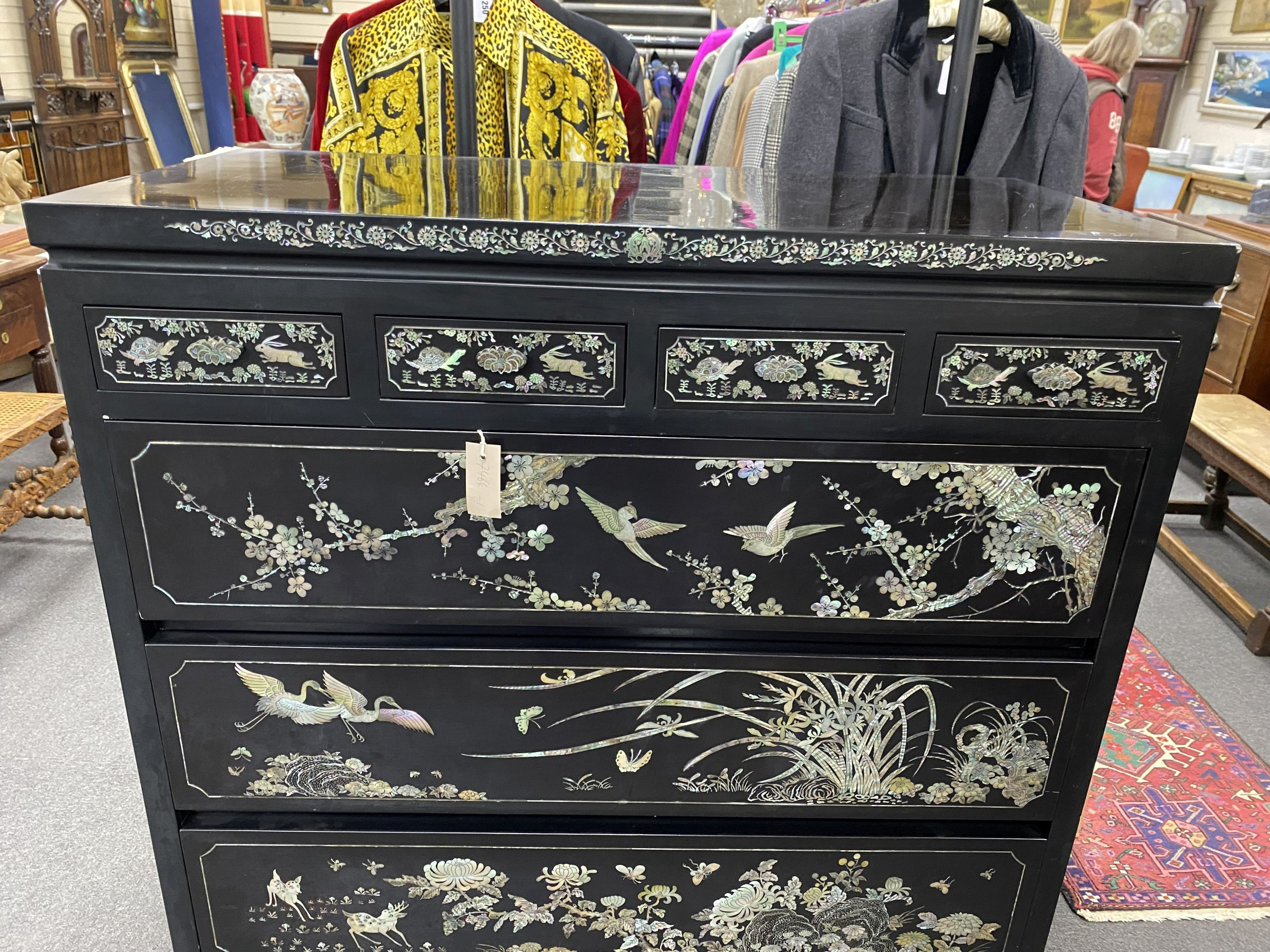 A Japanese black lacquer and mother of pearl inlaid kimono chest, width 104cm, depth 52cm, height 128cm